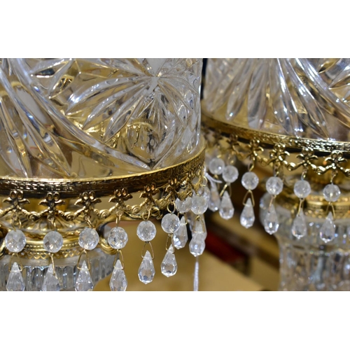 513 - A PAIR OF KLEIN BACCARAT CRYSTAL TABLE LAMPS, with a diamond cut crystal body on a brass base, elong... 