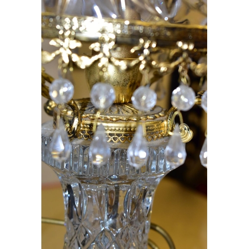 513 - A PAIR OF KLEIN BACCARAT CRYSTAL TABLE LAMPS, with a diamond cut crystal body on a brass base, elong... 