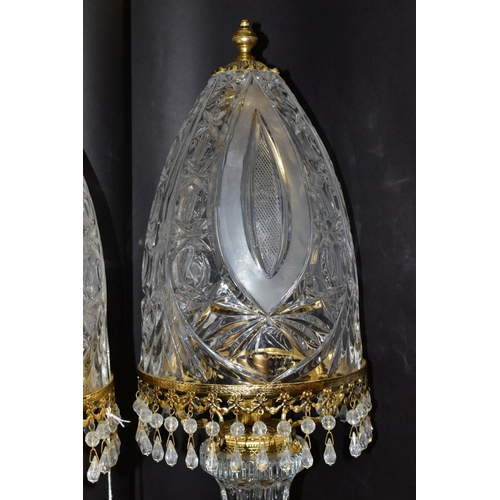 513 - A PAIR OF KLEIN BACCARAT CRYSTAL TABLE LAMPS, with a diamond cut crystal body on a brass base, elong... 