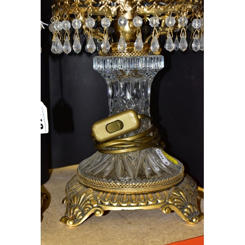 513 - A PAIR OF KLEIN BACCARAT CRYSTAL TABLE LAMPS, with a diamond cut crystal body on a brass base, elong... 