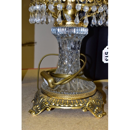 513 - A PAIR OF KLEIN BACCARAT CRYSTAL TABLE LAMPS, with a diamond cut crystal body on a brass base, elong... 
