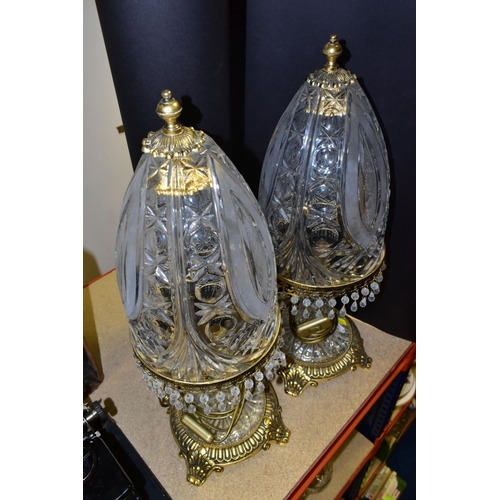 513 - A PAIR OF KLEIN BACCARAT CRYSTAL TABLE LAMPS, with a diamond cut crystal body on a brass base, elong... 