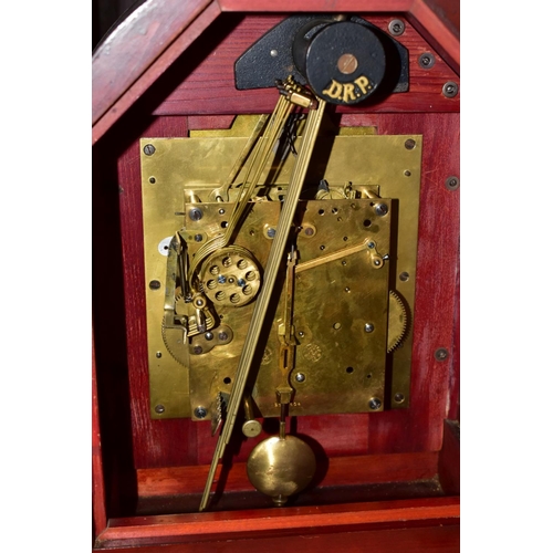 551 - AN EARLY 20TH CENTURY MAHOGANY CASED BRACKET CLOCK, arched pediment on Doric columns flanking the be... 