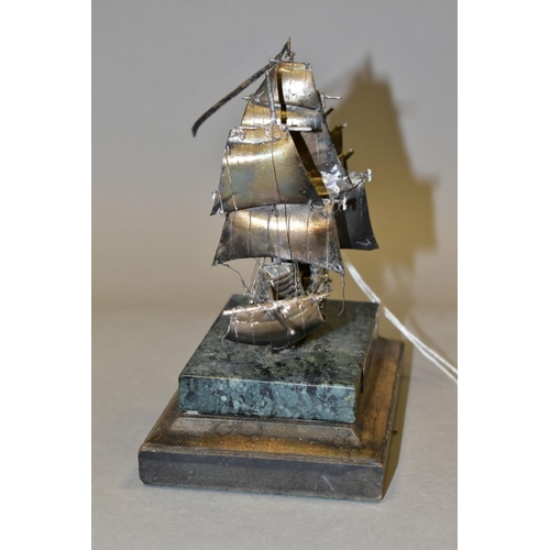 580 - A LIMITED EDITION SILVER MODEL OF THE MARY ROSE, mounted on an onyx and mahogany plinth, makers St J... 