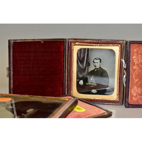 581 - THREE VICTORIAN AMBROTYPES, all three in leather and velvet cases, the largest with split hinge, com... 
