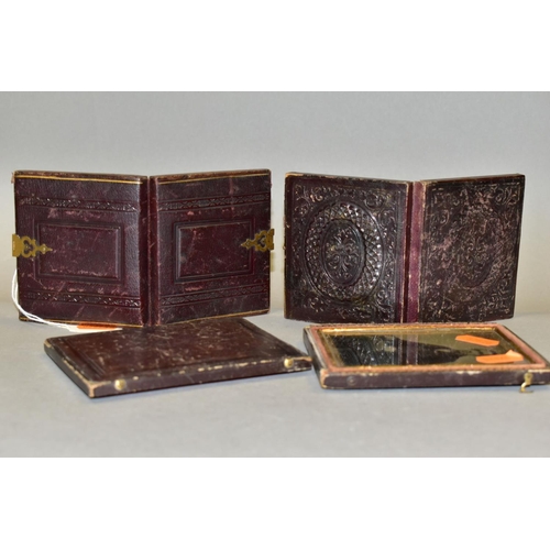 581 - THREE VICTORIAN AMBROTYPES, all three in leather and velvet cases, the largest with split hinge, com... 