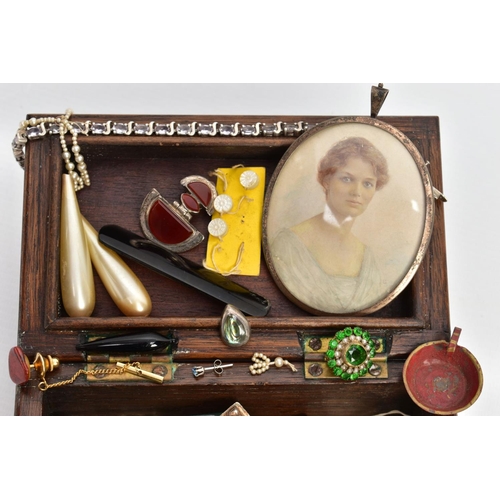 109 - A SMALL HINGED WALNUT BOX CONTAINING MAINLY JEWELLERY, to include an oval 9ct gold double sided phot... 