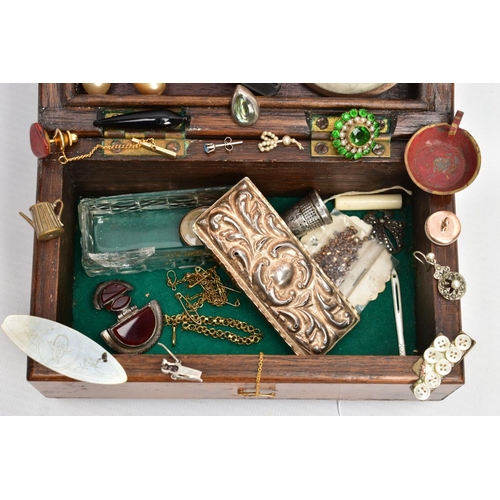 109 - A SMALL HINGED WALNUT BOX CONTAINING MAINLY JEWELLERY, to include an oval 9ct gold double sided phot... 