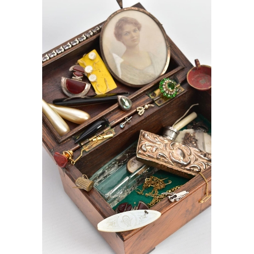 109 - A SMALL HINGED WALNUT BOX CONTAINING MAINLY JEWELLERY, to include an oval 9ct gold double sided phot... 