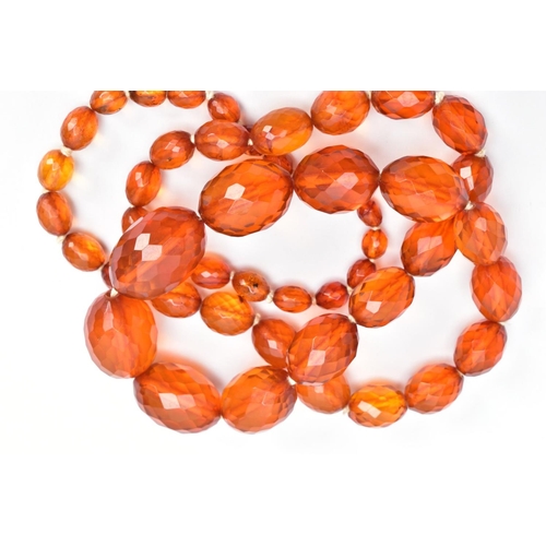 60 - TWO SETS OF ORANGE FACETED PLASTIC BEAD NECKLACES, each designed with graduated, faceted oval beads,... 