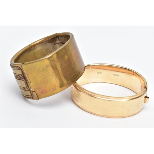 66 - A ROLLED GOLD BANGLE AND ONE OTHER, the rolled gold bangle with a floral design to one side, fitted ... 