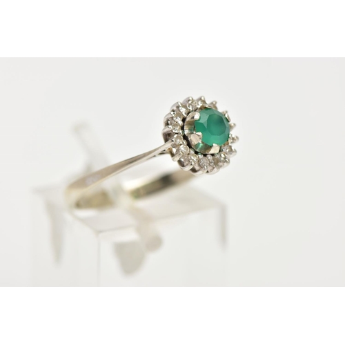 8 - A GREEN CHALCEDONY AND DIAMOND CLUSTER RING, the central circular green chalcedony within a single c... 