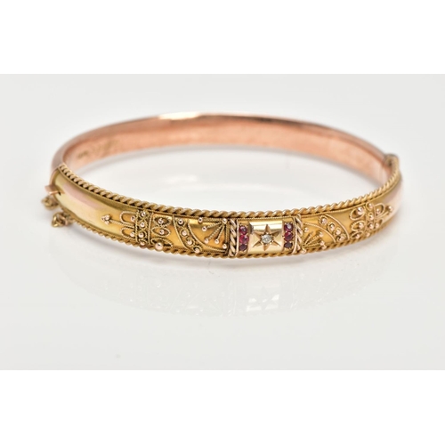 98 - AN EARLY 20TH CENTURY GOLD BANGLE, a 9ct gold hollow hinged bangle, set with a single rose cut diamo... 