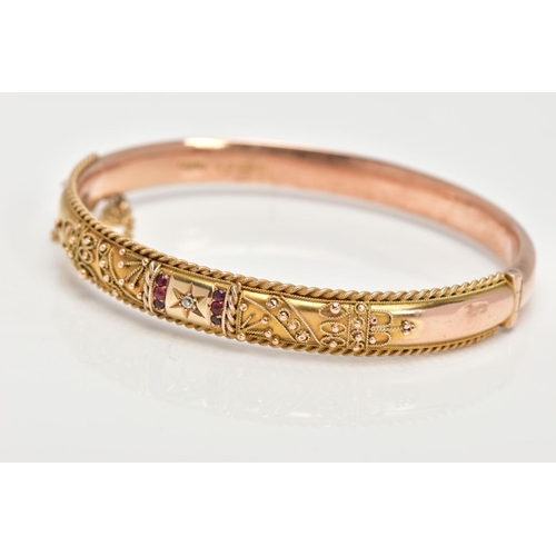 98 - AN EARLY 20TH CENTURY GOLD BANGLE, a 9ct gold hollow hinged bangle, set with a single rose cut diamo... 