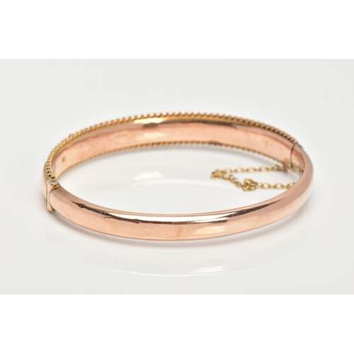 98 - AN EARLY 20TH CENTURY GOLD BANGLE, a 9ct gold hollow hinged bangle, set with a single rose cut diamo... 
