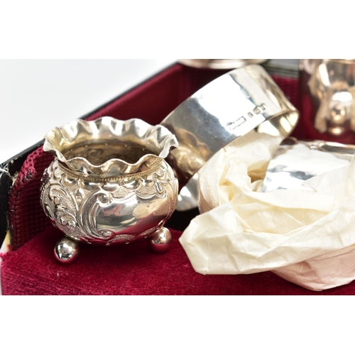 101 - A SET OF SILVER NAPKIN RINGS AND SILVER CONDIMENTS ITEMS, four silver hammered finished napkin rings... 