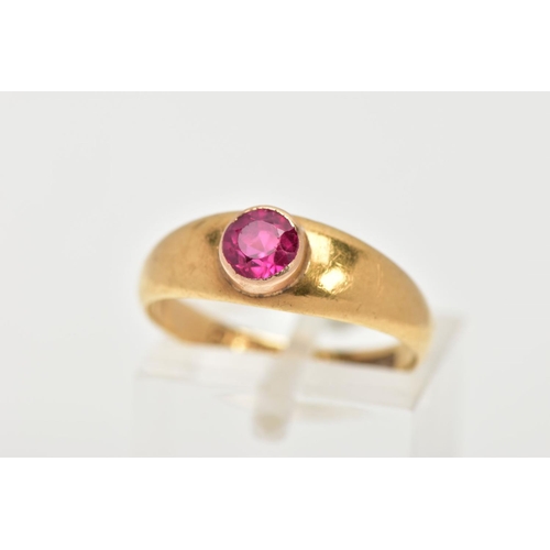 11 - AN 18CT GOLD RUBY RING, a circular cut ruby, bezel set, domed tapered band, approximate width 6mm to... 