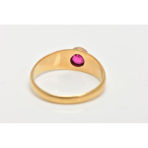 11 - AN 18CT GOLD RUBY RING, a circular cut ruby, bezel set, domed tapered band, approximate width 6mm to... 