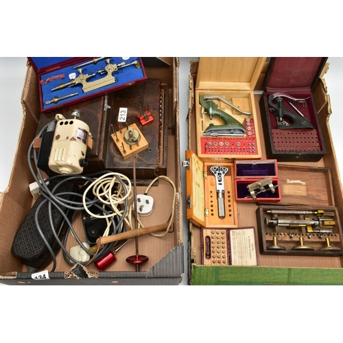 134 - TWO BOXES OF WATCH MAKERS TOOLS AND EQUPIMENTS, to include a cased 'Seitz' pusher press with attachm... 