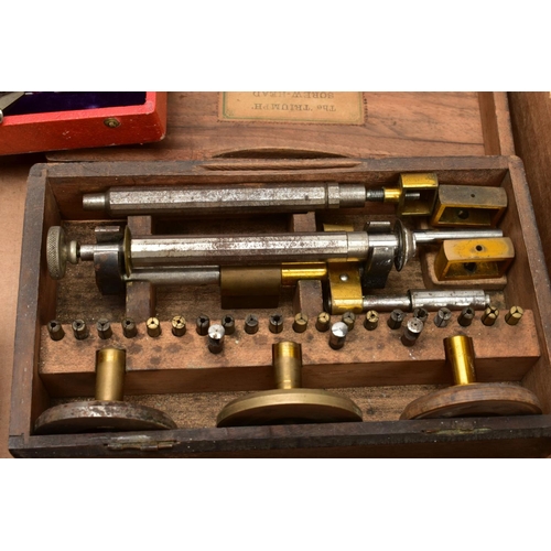 134 - TWO BOXES OF WATCH MAKERS TOOLS AND EQUPIMENTS, to include a cased 'Seitz' pusher press with attachm... 