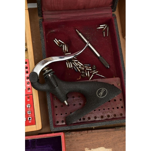 134 - TWO BOXES OF WATCH MAKERS TOOLS AND EQUPIMENTS, to include a cased 'Seitz' pusher press with attachm... 