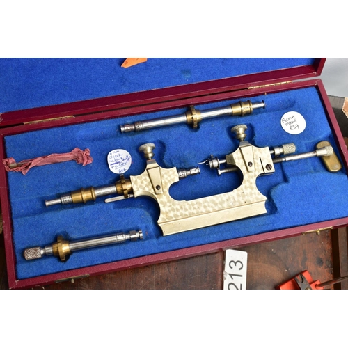 134 - TWO BOXES OF WATCH MAKERS TOOLS AND EQUPIMENTS, to include a cased 'Seitz' pusher press with attachm... 