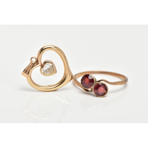 145 - A YELLOW METAL GARNET RING AND A PENDANT, the ring of a crossover design, set with two circular cut ... 