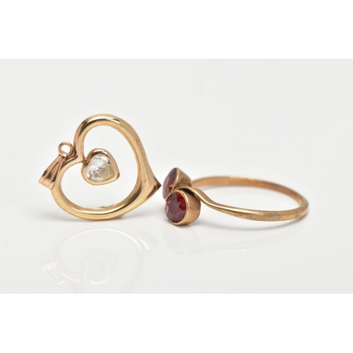 145 - A YELLOW METAL GARNET RING AND A PENDANT, the ring of a crossover design, set with two circular cut ... 