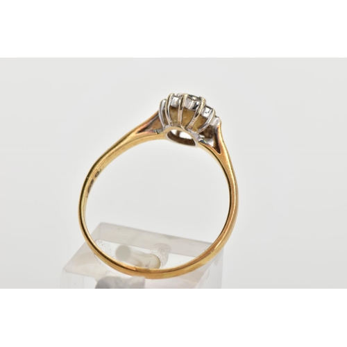 146 - AN 18CT GOLD GEM SET CLUSTER RING, of an oval form, centring on an oval cut aquamarine, within a sur... 