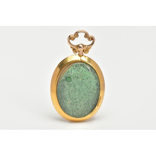 151 - A 9CT GOLD PHOTO PENDANT, an oval pendant fitted with a scroll detail screw bail, a colour photograp... 