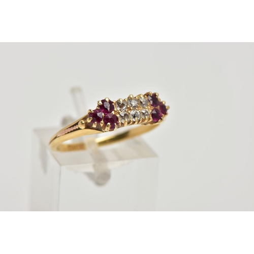 153 - A DIAMOND AND RUBY RING,  six old cut diamonds prong set in yellow metal, accented with three circul... 