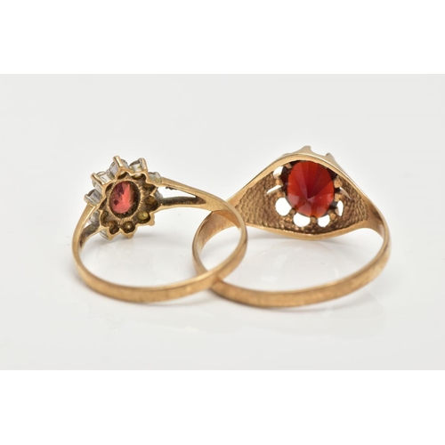 16 - TWO 9CT GOLD GARNET RINGS, the first of an oval design set with an oval cut garnet within a ten claw... 