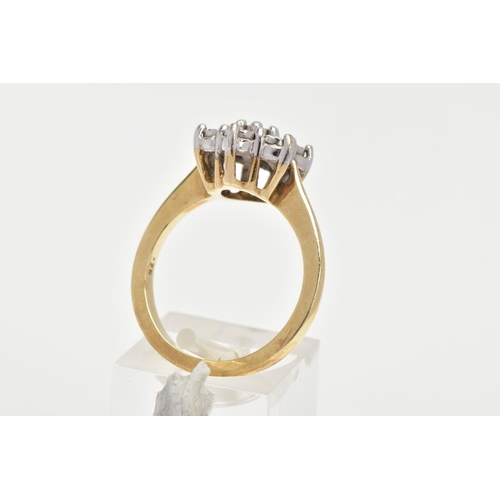 160 - A 9CT GOLD DIAMOND CLUSTER RING, seven round brilliant cut diamonds in a white gold illusion setting... 