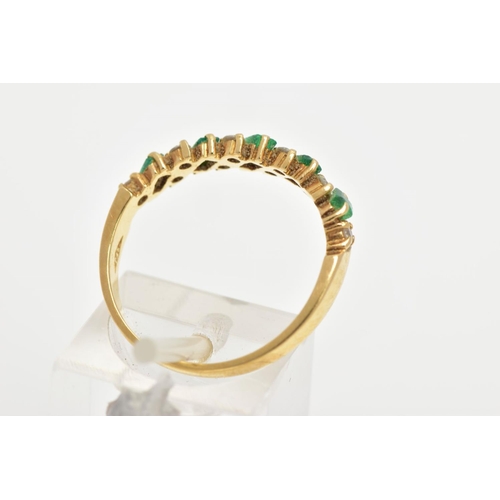 161 - AN 18CT GOLD EMERALD AND DIAMOND HALF ETERNITY RING, designed with a row of rectangular cut emeralds... 