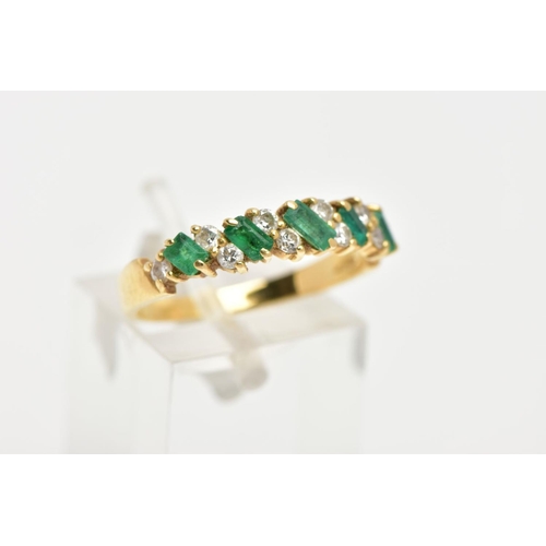 161 - AN 18CT GOLD EMERALD AND DIAMOND HALF ETERNITY RING, designed with a row of rectangular cut emeralds... 