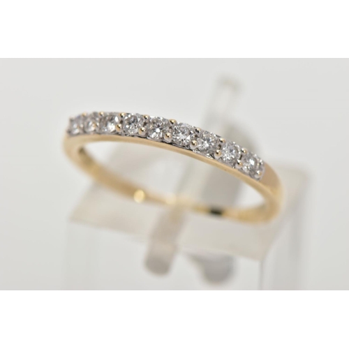 167 - A 9CT GOLD DIAMOND HALF ETERNITY RING, designed with a row of nine claw set round brilliant cut diam... 