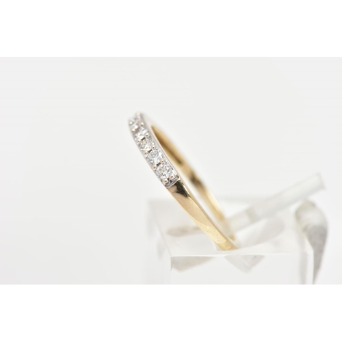 167 - A 9CT GOLD DIAMOND HALF ETERNITY RING, designed with a row of nine claw set round brilliant cut diam... 