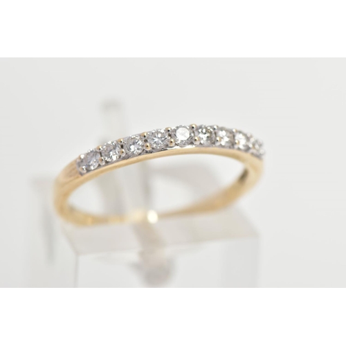 167 - A 9CT GOLD DIAMOND HALF ETERNITY RING, designed with a row of nine claw set round brilliant cut diam... 