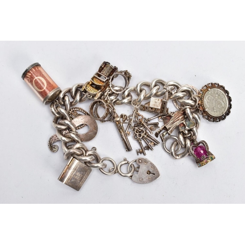 181 - A SILVER CHARM BRACELET AND CHARMS, a thick curb link bracelet, fitted with spring clasp and a heart... 