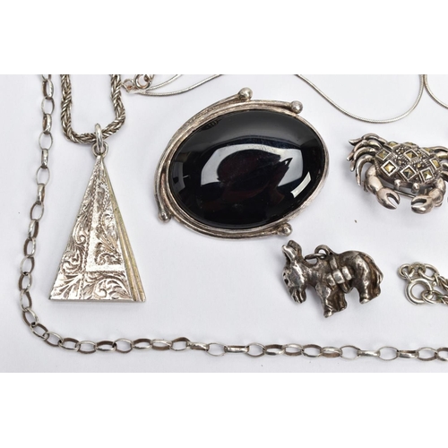 185 - AN ASSORTMENT OF SILVER AND WHITE METAL JEWELLERY,  to include a triangular pendant with foliage eng... 