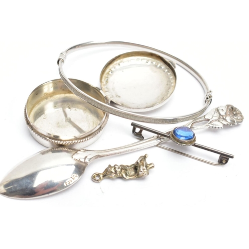 187 - FIVE WHITE METAL ITEMS, to include a white metal floral detailed teaspoon, stamped 800, a small roun... 