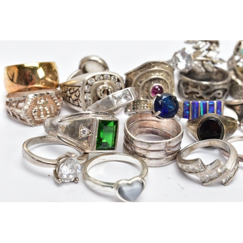 194 - AN ASSORTEMENT OF WHITE METAL RINGS, to include a large silver signet ring set with colourless stone... 