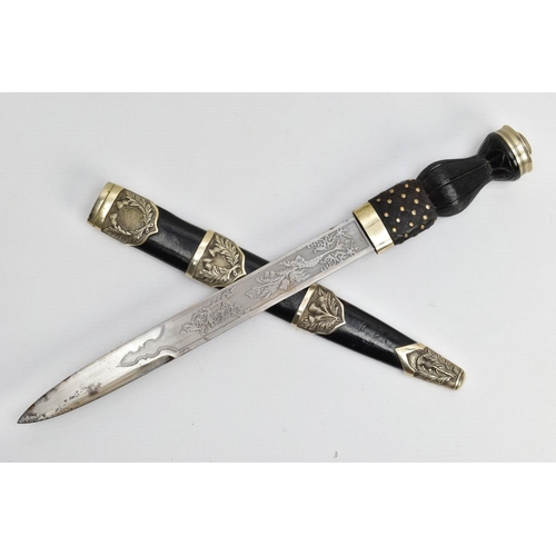 195 - A MODERN SCOTTISH PIPERS DIRK, nickel crown pommel set into a basket weave carved ebonised and brass... 