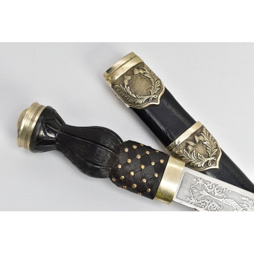 195 - A MODERN SCOTTISH PIPERS DIRK, nickel crown pommel set into a basket weave carved ebonised and brass... 