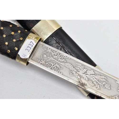 195 - A MODERN SCOTTISH PIPERS DIRK, nickel crown pommel set into a basket weave carved ebonised and brass... 