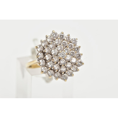 197 - A 9CT GOLD CUBIC ZIRCONIA CLUSTER RING, thirty seven circular cut cubic zirconia within a yellow met... 