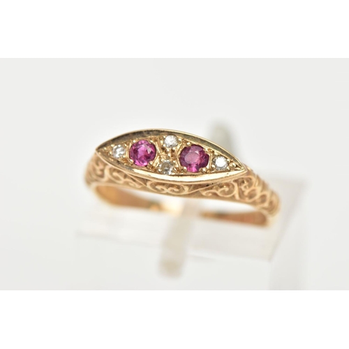 28 - A 9CT GOLD RUBY AND DIAMOND BOAT RING, a navette shaped ring set with two circular cut ruby stones, ... 