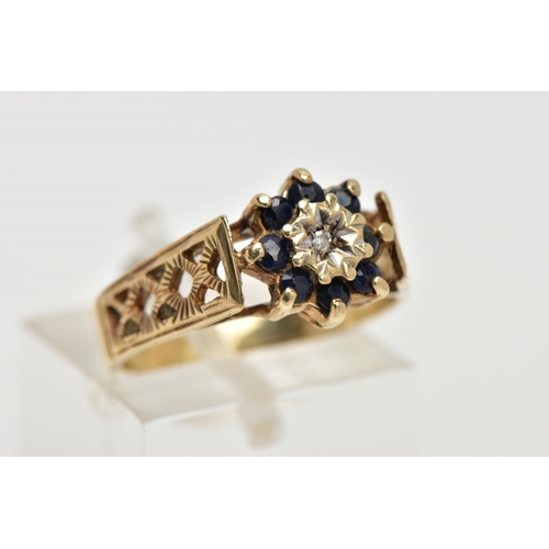 30 - A SAPPHIRE AND DIAMOND CLUSTER RING, four circular cut sapphires surrounding a round brilliant cut d... 