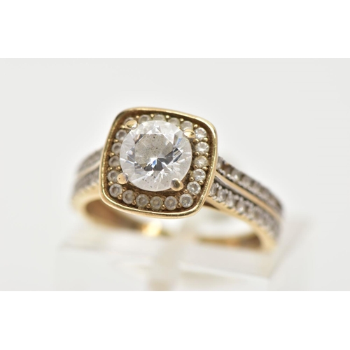 33 - A 9CT GOLD CUBIC ZIRCONIA RING,  a circular cut cubic zirconia, set within a squared halo of circula... 