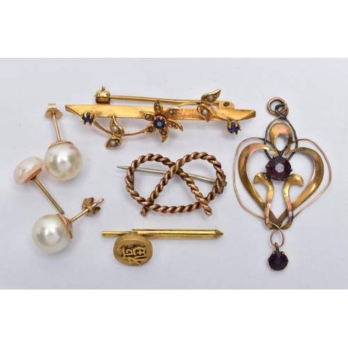 51 - AN ASSORTMENT OF YELLOW METAL ITEMS, to include a yellow metal knotted rope brooch, a floral brooch ... 